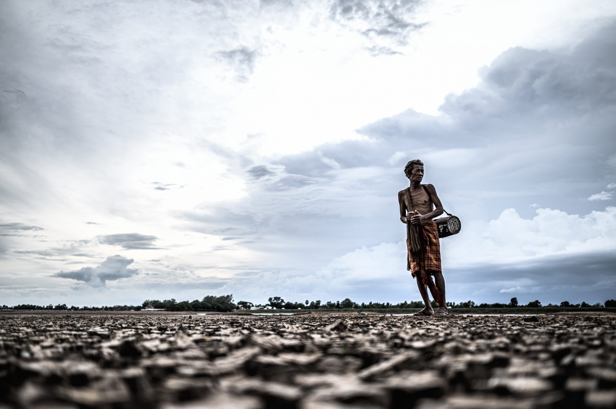 Elderly men find fish on dry ground,global warming